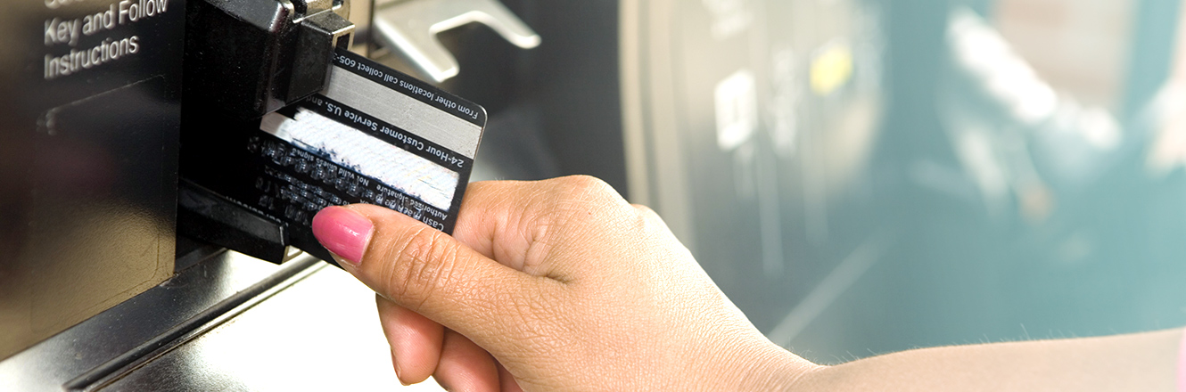 Swiping card at gas station