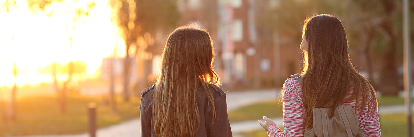 teenage friends talking outside