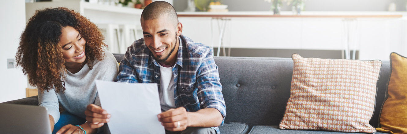 Couple smiling about their finances