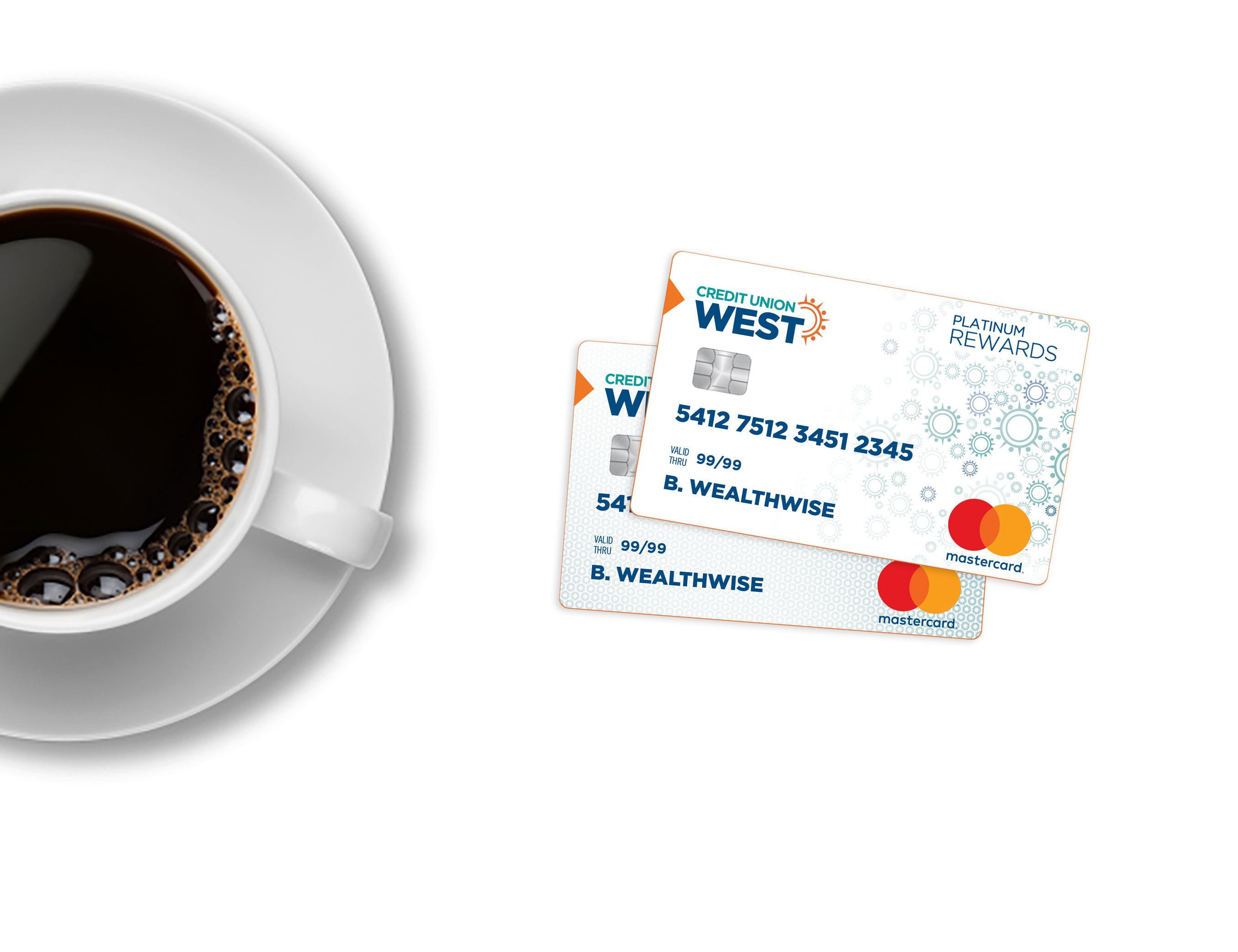 credit cards fanned out next to coffee cup