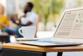 A laptop and coffee mug