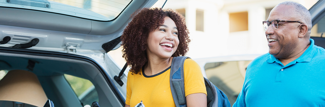 young woman packing for college