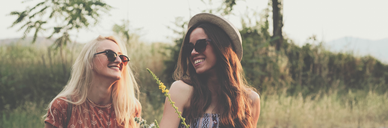 two friends, laughing, biking and shopping
