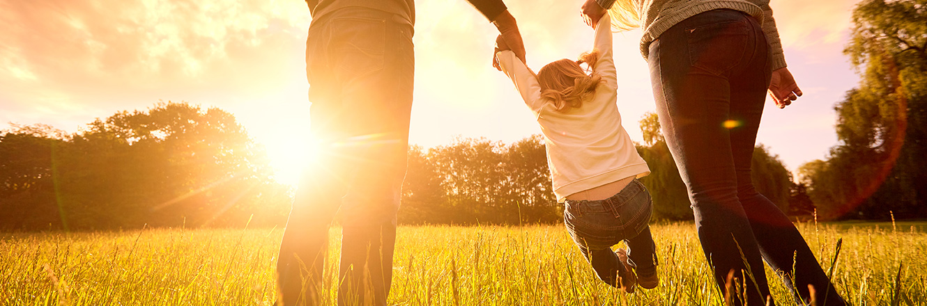 parents with child having fun outdoors