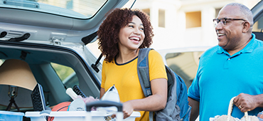 young woman packing for college