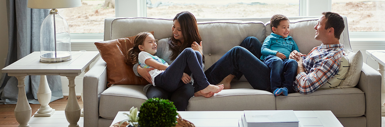 family sitting on couch together
