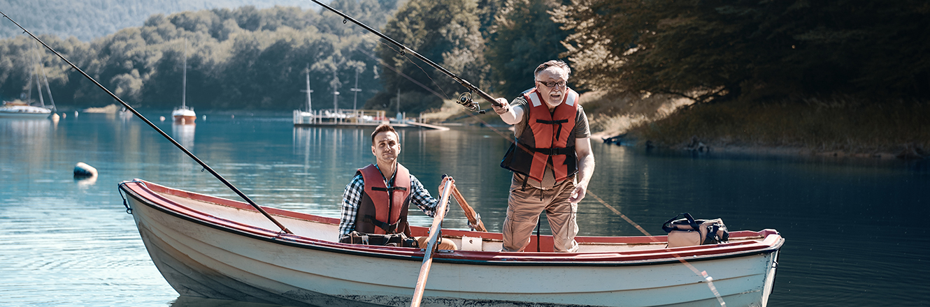 Two men fishing from a small boat