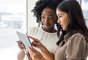 women looking at tablet