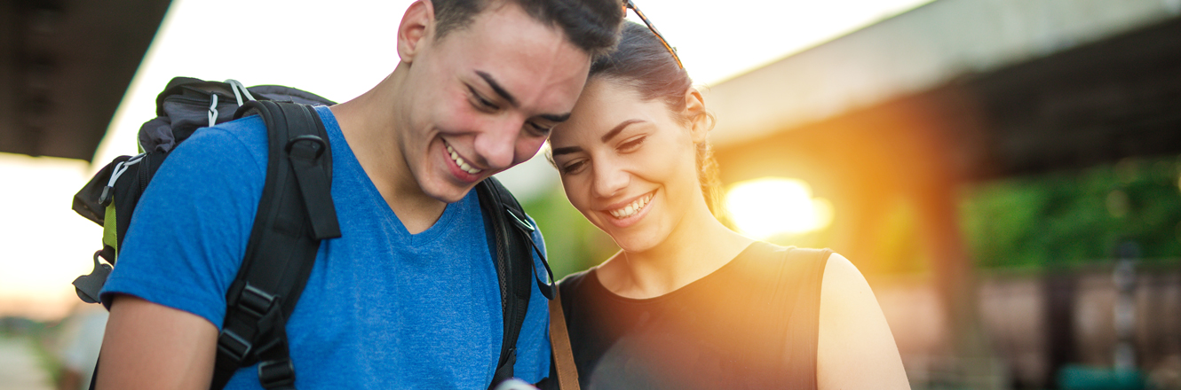 Couple making a payment while traveling