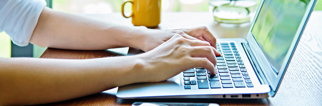 woman typing on computer