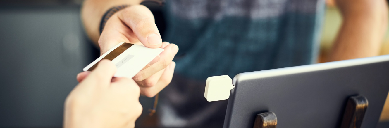 A person paying with a debit/credit card