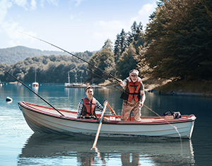 Two men fishing from a small boat