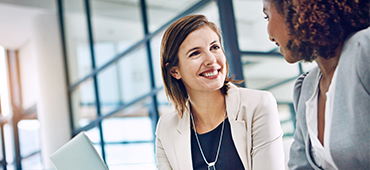 two business women engaged in conversation