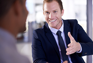 man holding out hand to shake