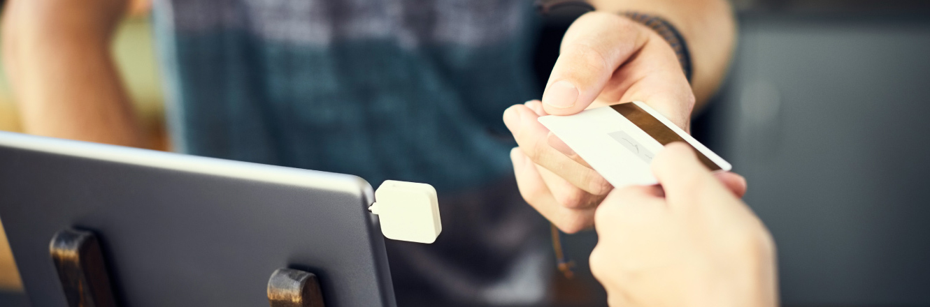 A person paying with a debit/credit card