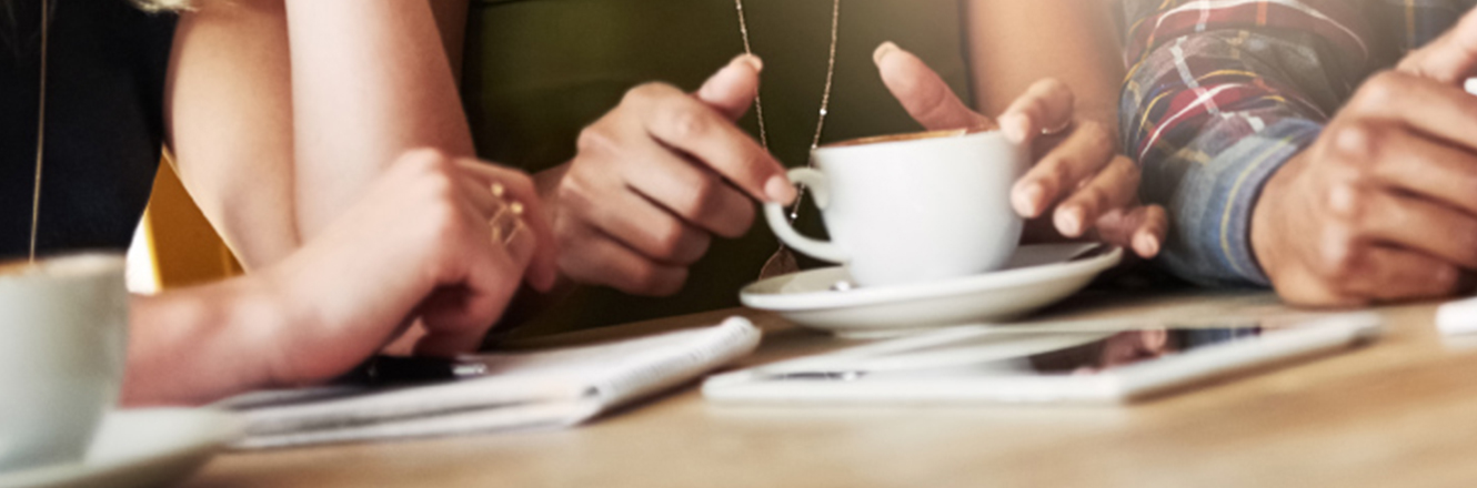 friends sitting at coffee table