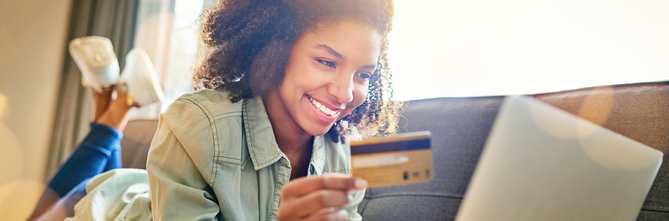 woman checking card rewards on computer