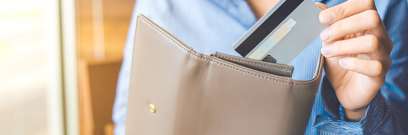 pulling credit or debit card out of wallet