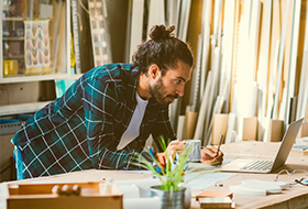 business owner using laptop