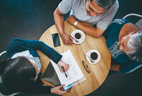 sitting at table with financial advisor