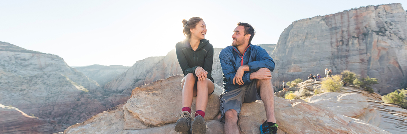 Two people resting after a hike