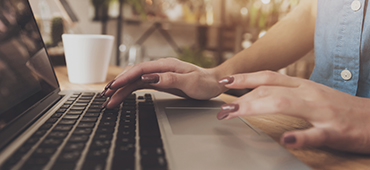 woman typing on computer