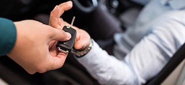 holding out car keys