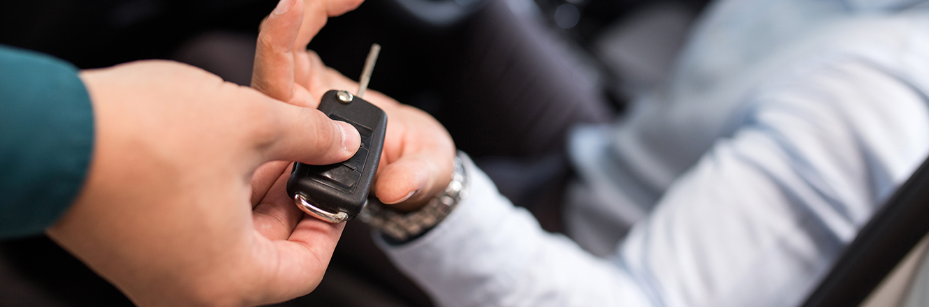 holding out car keys