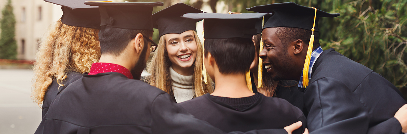 group of 6 graduates talking